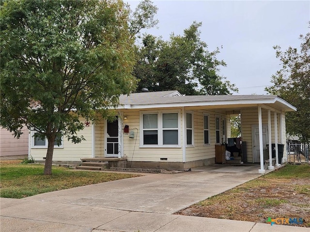 view of front of home with a carport