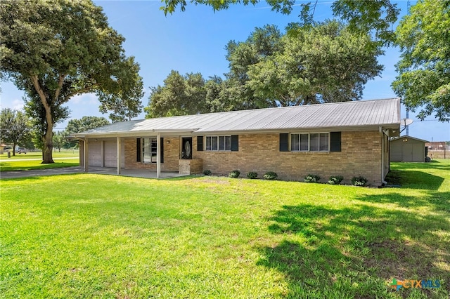 ranch-style house with covered porch, a garage, and a front lawn