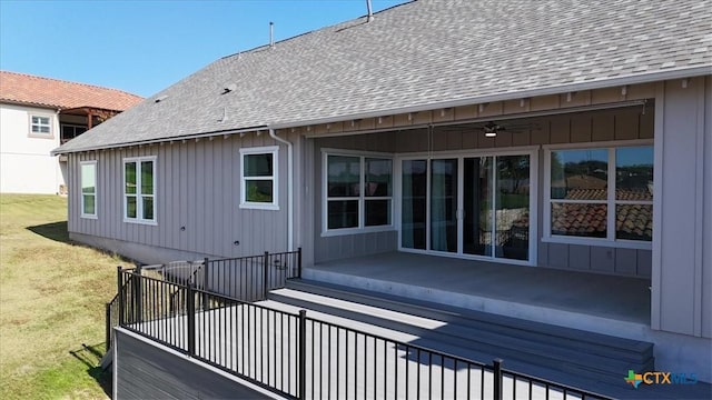 exterior space featuring ceiling fan and a yard