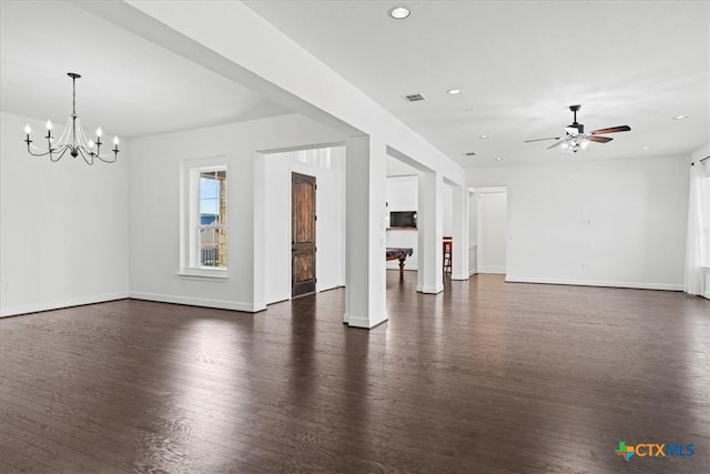 unfurnished living room with dark hardwood / wood-style floors and ceiling fan with notable chandelier