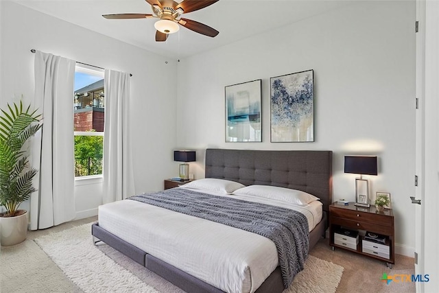 carpeted bedroom featuring ceiling fan