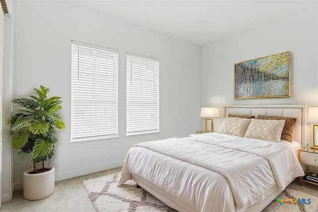 bedroom with light carpet