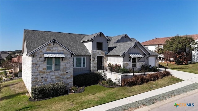 view of front of property with a front lawn