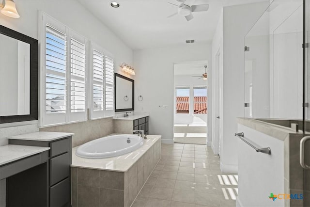 bathroom with tile patterned flooring, vanity, independent shower and bath, and ceiling fan