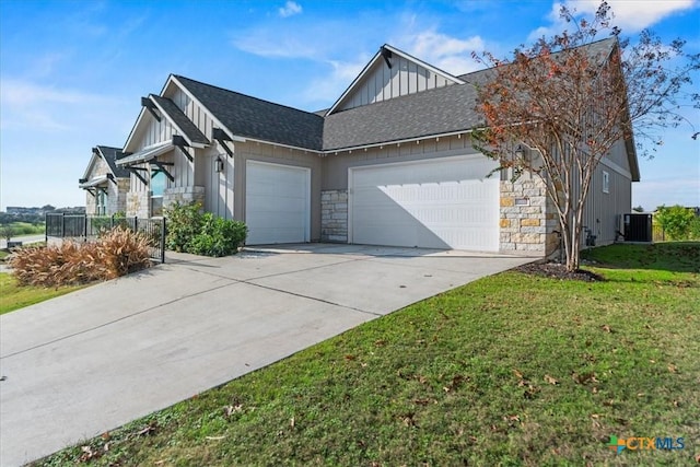 view of home's exterior with central AC, a garage, and a yard