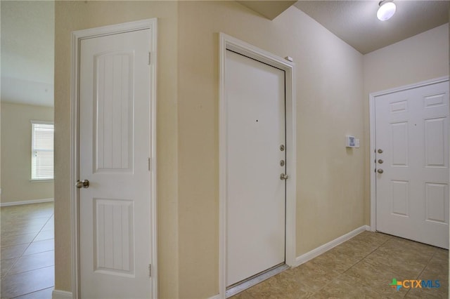 775 Spectrum Dr, New Braunfels, TX 78130 - entryway with light tile patterned floors and baseboards