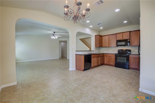 775 Spectrum Dr, New Braunfels, TX 78130 - kitchen with black appliances, arched walkways, brown cabinets, tasteful backsplash, and lofted ceiling