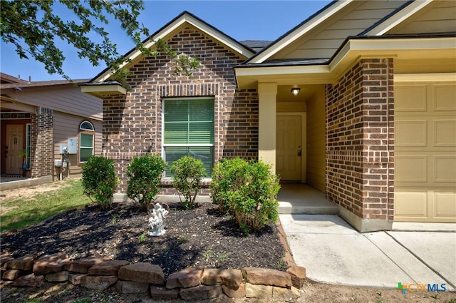775 Spectrum Dr, New Braunfels, TX 78130 - property entrance featuring brick siding and a garage