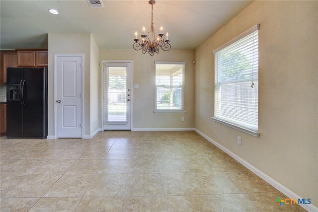 775 Spectrum Dr, New Braunfels, TX 78130 - unfurnished dining area with a chandelier and light tile patterned floors