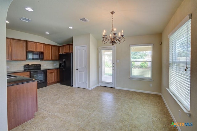 775 Spectrum Dr, New Braunfels, TX 78130 - kitchen featuring black appliances, lofted ceiling, brown cabinets, decorative backsplash, and a chandelier