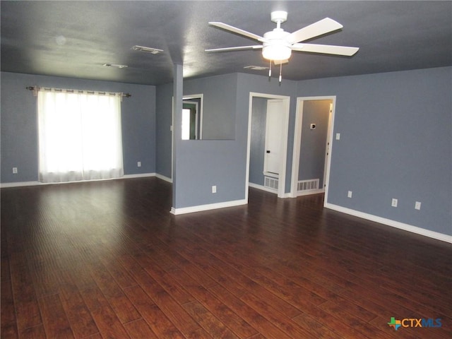 empty room featuring ceiling fan and dark hardwood / wood-style flooring