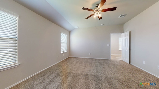 unfurnished room featuring light colored carpet and ceiling fan