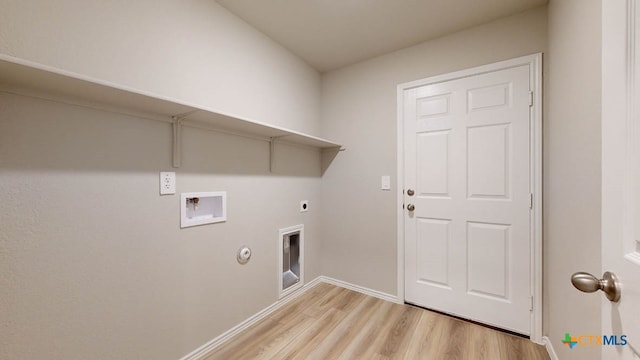 clothes washing area featuring washer hookup, hookup for a gas dryer, hookup for an electric dryer, and light hardwood / wood-style flooring