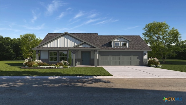 view of front of house with a front yard and a garage