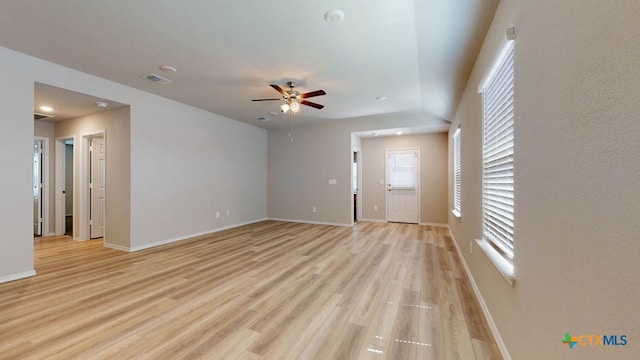 unfurnished living room with light hardwood / wood-style flooring and ceiling fan