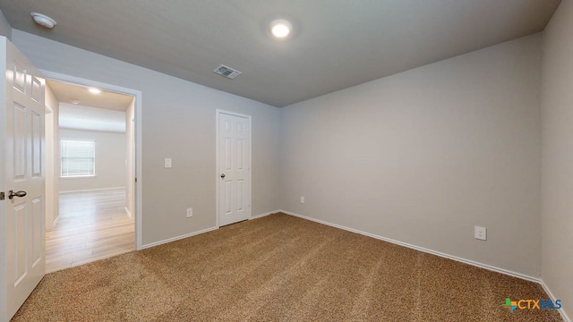 unfurnished bedroom with carpet