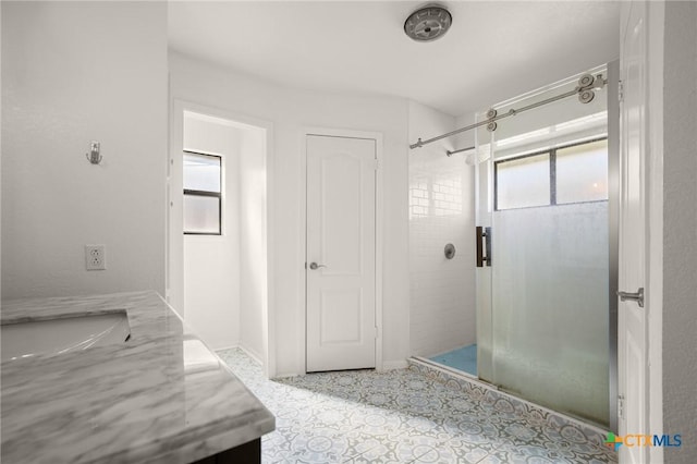 bathroom with vanity and walk in shower