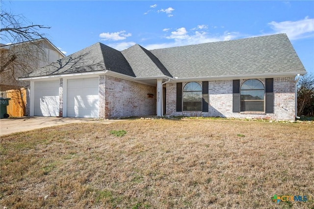 single story home with a front lawn and a garage