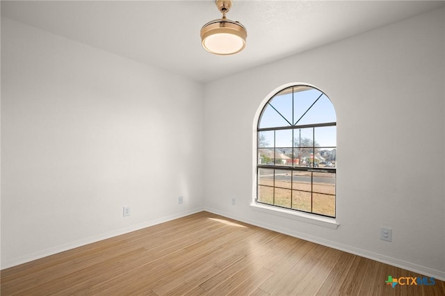 spare room featuring light hardwood / wood-style flooring