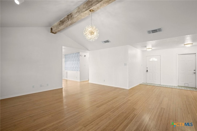 unfurnished living room featuring hardwood / wood-style flooring, a notable chandelier, and vaulted ceiling with beams