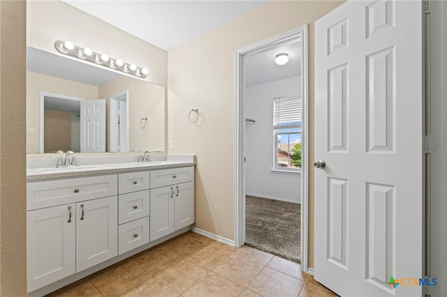 9305 Devonshire Ct, Killeen, TX 76542 - full bath with double vanity, tile patterned flooring, and baseboards