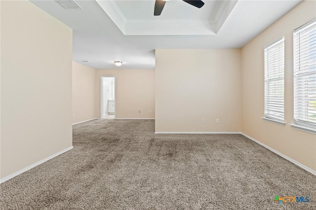 9305 Devonshire Ct, Killeen, TX 76542 - spare room featuring a raised ceiling, carpet flooring, a ceiling fan, plenty of natural light, and ornamental molding