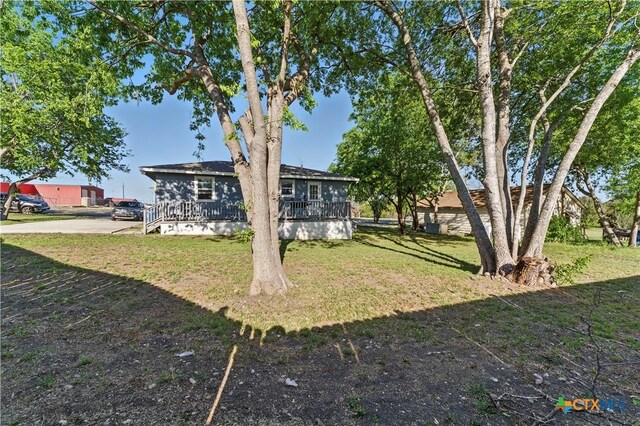 view of yard featuring a wooden deck