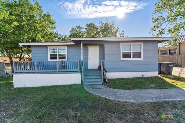 ranch-style home with a front lawn