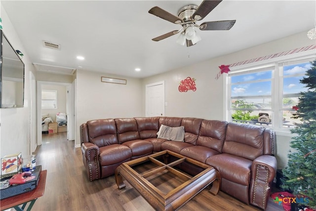 living area with recessed lighting, a ceiling fan, visible vents, and wood finished floors