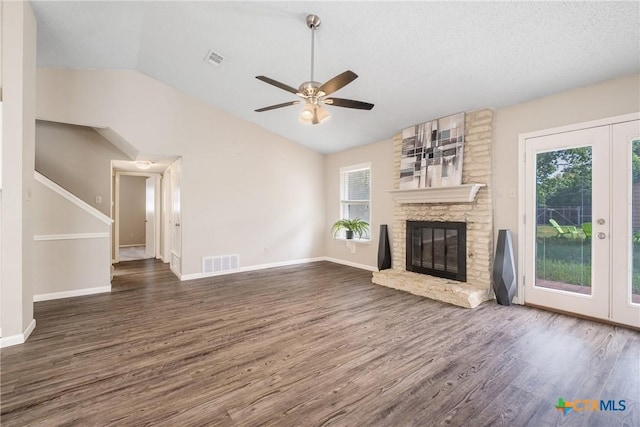7503 Islander Dr, Austin, TX 78749 - unfurnished living room with vaulted ceiling, french doors, healthy amount of natural light, wood finished floors, and ceiling fan