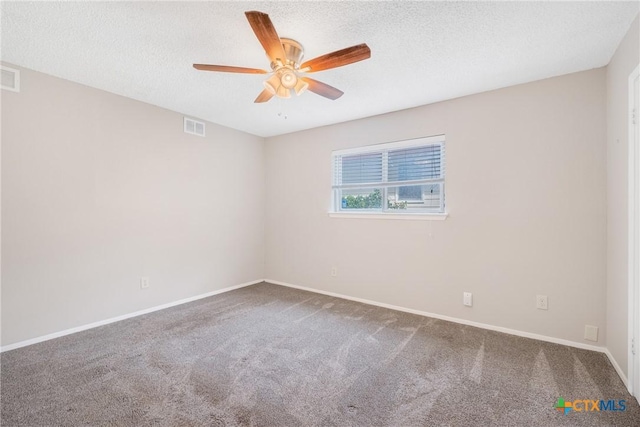 7503 Islander Dr, Austin, TX 78749 - carpeted spare room featuring a ceiling fan, a textured ceiling, and baseboards
