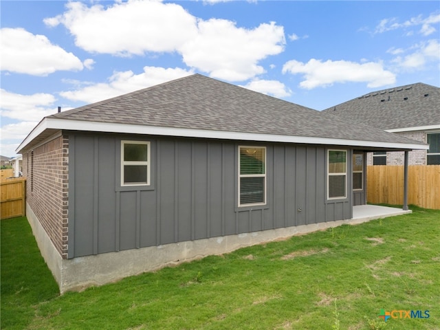 view of property exterior with a lawn