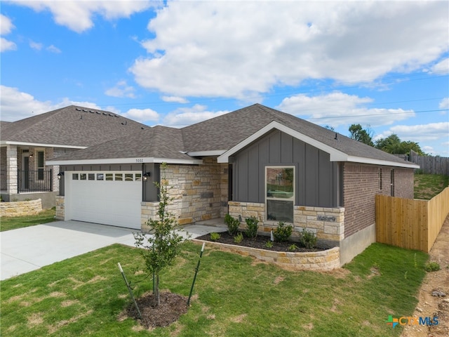 single story home with a garage and a front yard