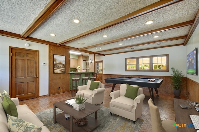 living room featuring recessed lighting, beamed ceiling, billiards, and a wainscoted wall