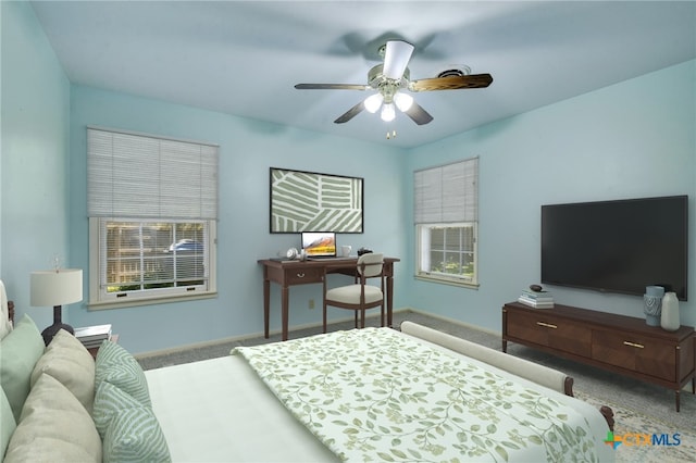 bedroom with carpet flooring, baseboards, and ceiling fan