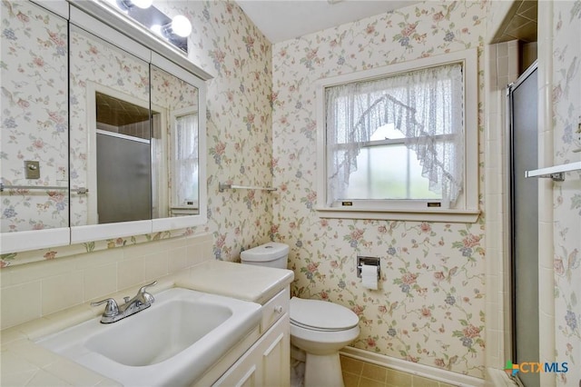 full bathroom with toilet, a stall shower, vanity, and tile patterned flooring