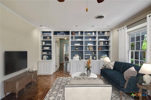 living area with crown molding, built in features, and visible vents