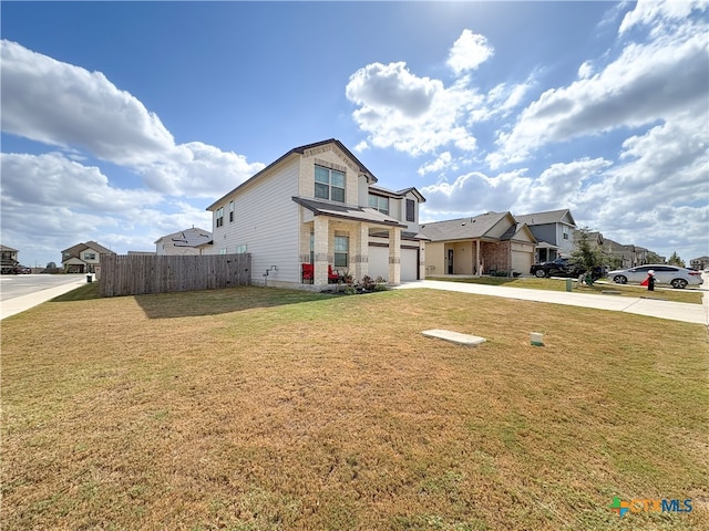 view of front of house featuring a garage and a front yard