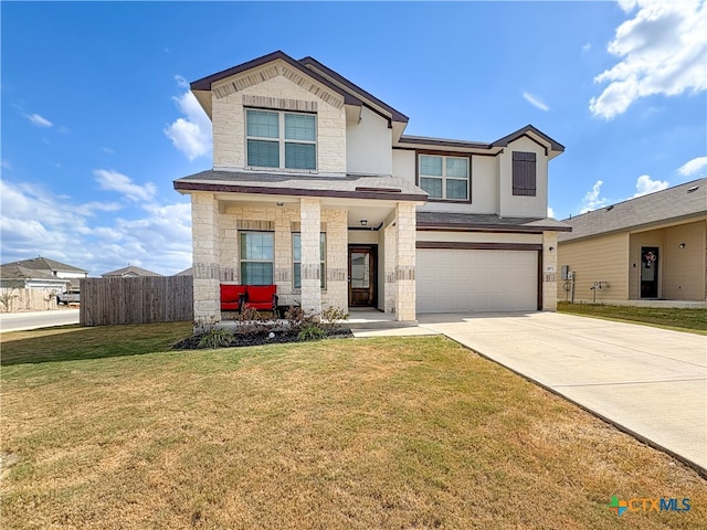 view of front of property with a garage and a front yard