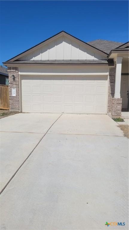 garage featuring driveway