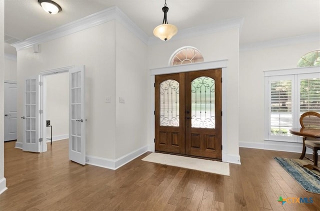 2901 Chisholm Trl, Salado, TX 76571 - foyer with french doors, ornamental molding, and wood finished floors