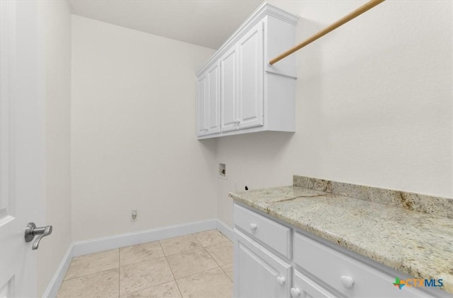 2901 Chisholm Trl, Salado, TX 76571 - washroom featuring cabinet space, hookup for a washing machine, hookup for an electric dryer, and light tile patterned floors