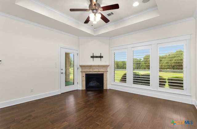 2901 Chisholm Trl, Salado, TX 76571 - unfurnished living room featuring a tray ceiling, a fireplace, wood finished floors, a ceiling fan, and crown molding