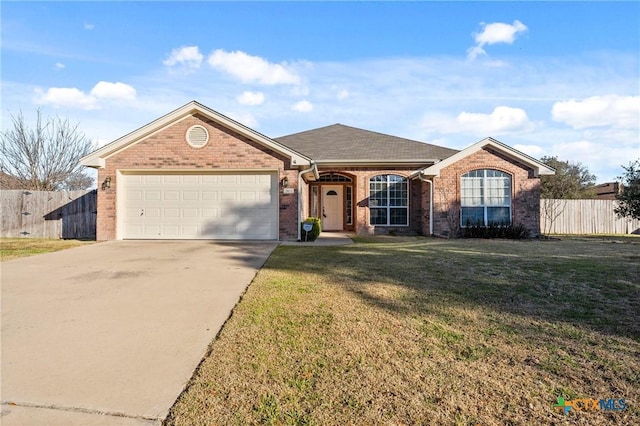 ranch-style house featuring a front lawn and a garage