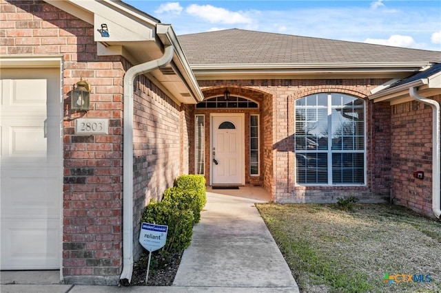 entrance to property featuring a garage