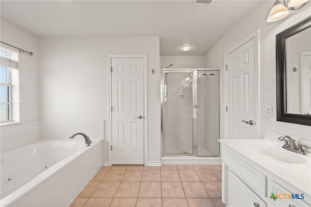 bathroom featuring vanity, tile patterned flooring, and independent shower and bath