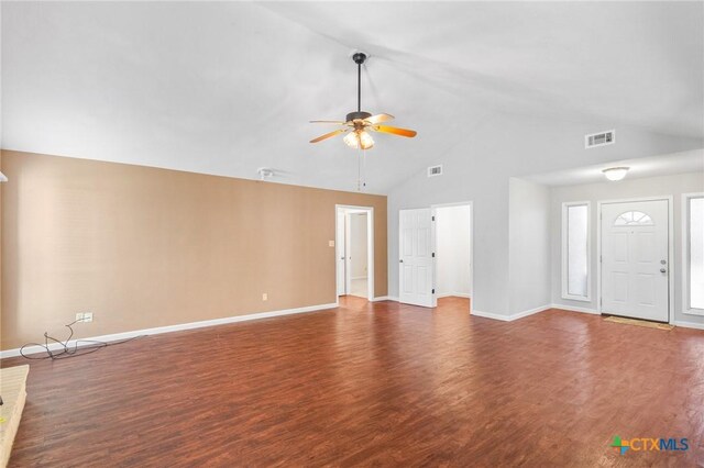 unfurnished living room with ceiling fan, wood finished floors, visible vents, and baseboards