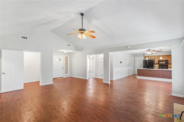 unfurnished living room featuring visible vents, baseboards, a ceiling fan, and wood finished floors