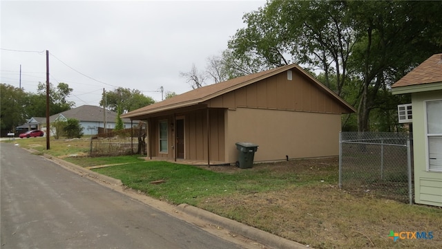 view of home's exterior with a lawn