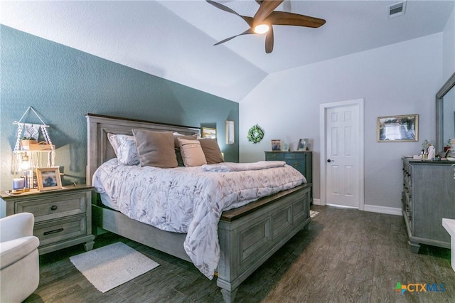 bedroom featuring ceiling fan, dark hardwood / wood-style floors, and vaulted ceiling